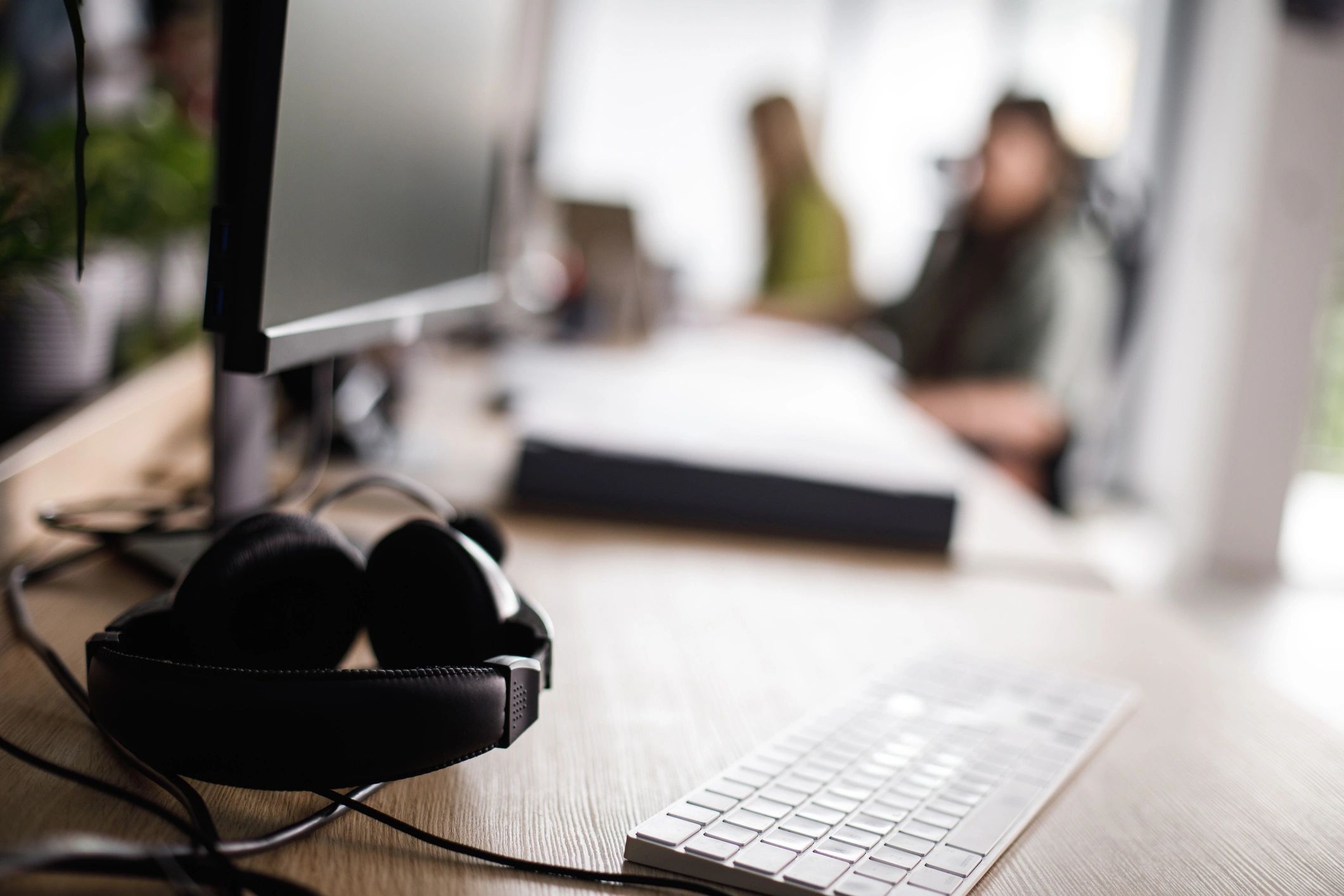 Computer desk with keyboard and headphones