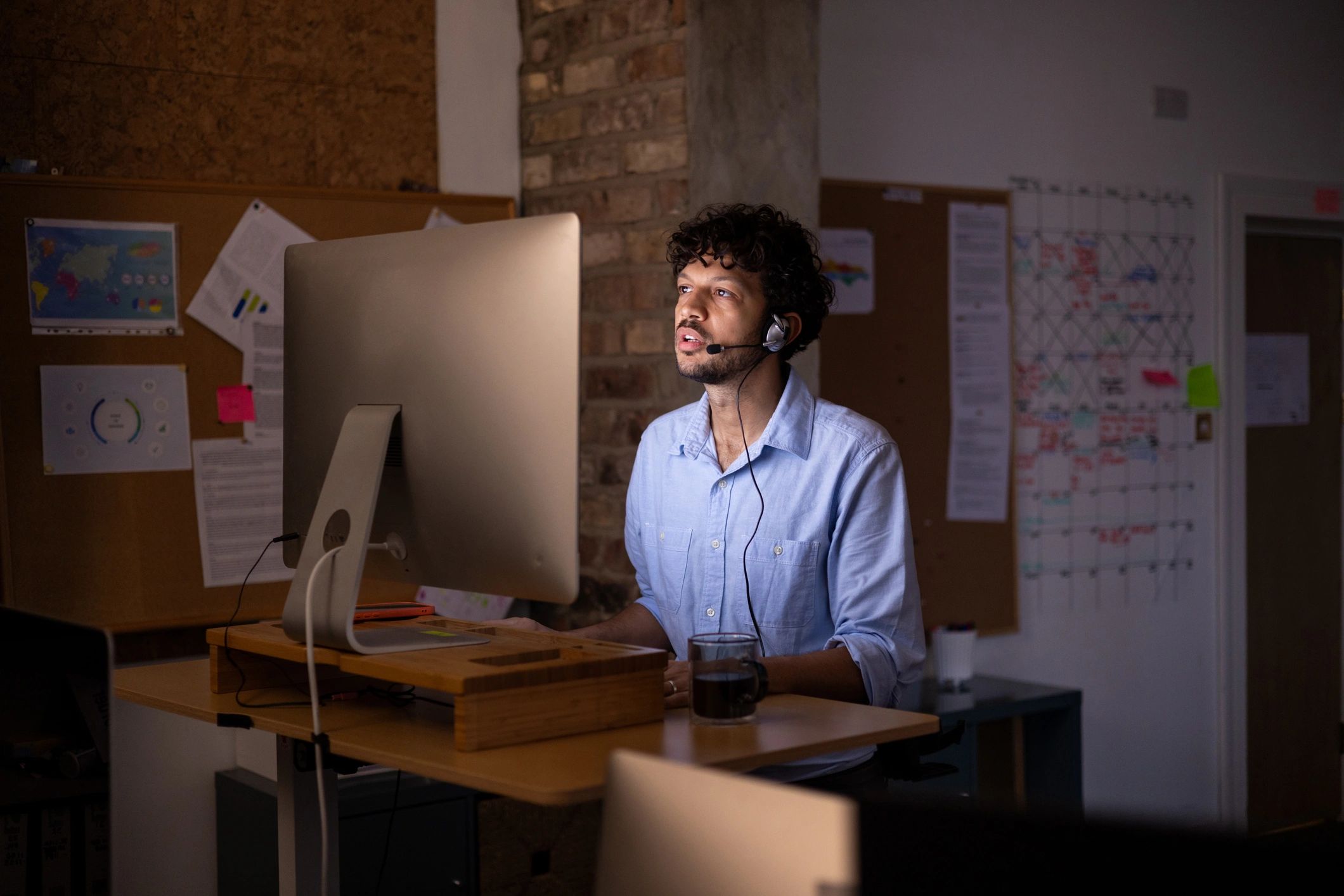 Support specialist working at a computer desk